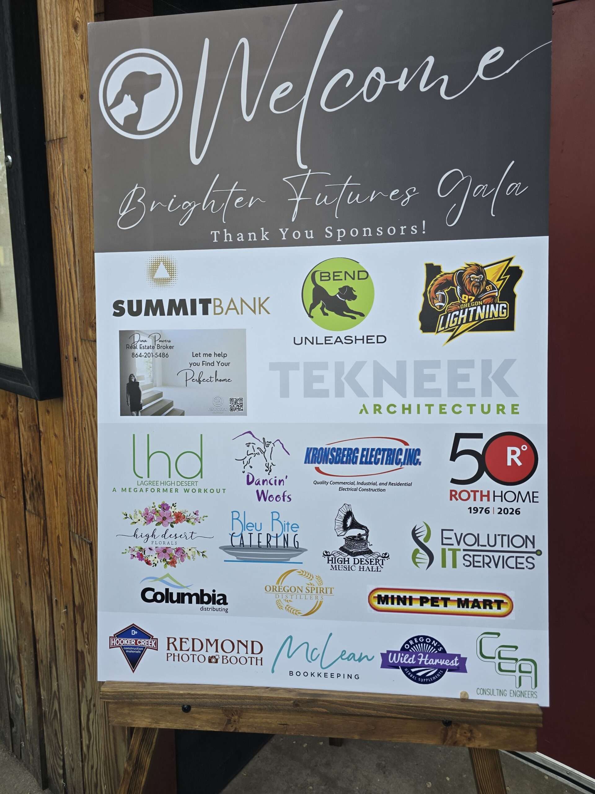 Welcome sign for the Brighter Futures Gala listing Evolution IT Services among the sponsors